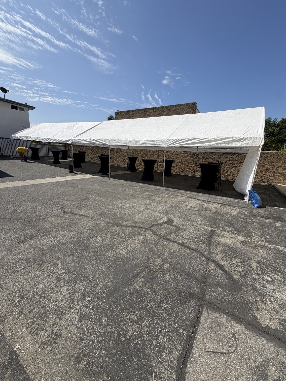 Outdoor white canopy and seating for a company event
